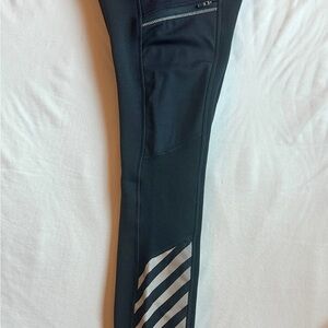 Athleta Black tand Gray Leggings with zipper pockets and reflective design